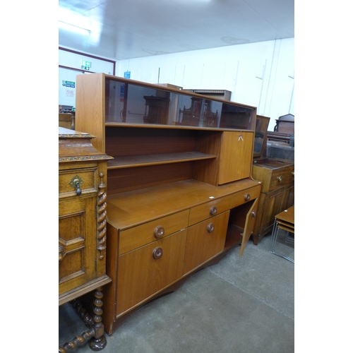 58 - A teak highboard