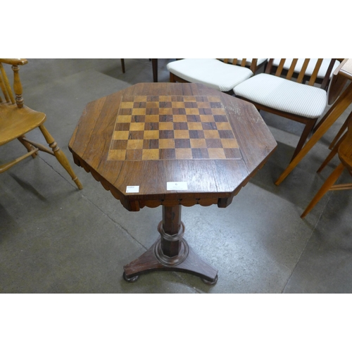 6 - A Victorian rosewood octagonal two drawer octagonal games table