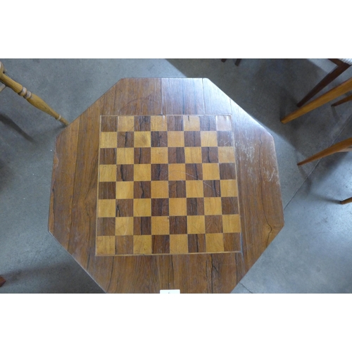 6 - A Victorian rosewood octagonal two drawer octagonal games table