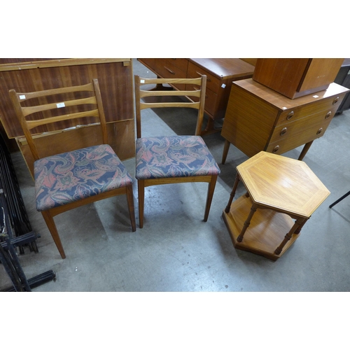 60 - A pair of teak chairs and a teak coffee table