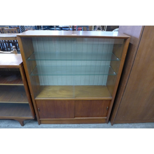 69 - A Herbert Gibbs teak display cabinet