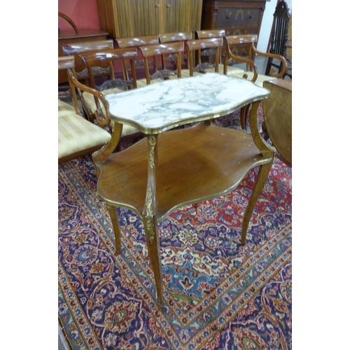 8 - A 19th Century French Louis XV style walnut, gilt metal and marble topped two tier etagere