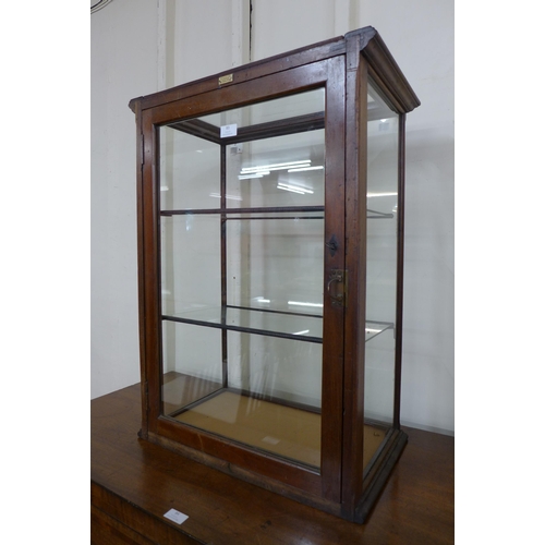 83 - A Victorian glazed mahogany counter top shop cabinet