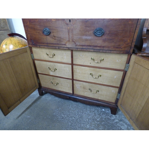 84 - A Regency inlaid mahogany fitted secretaire cupboard