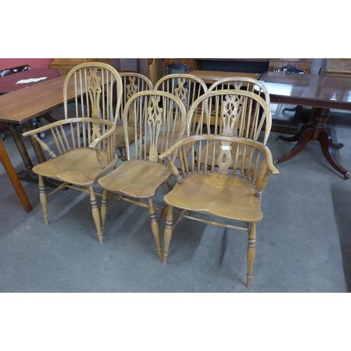 87 - A set of six Victorian style elm Windsor chairs