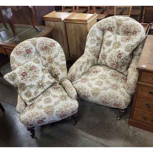 181 - A pair of Victorian lady's and gentleman's mahogany and upholstered chairs, one a/f