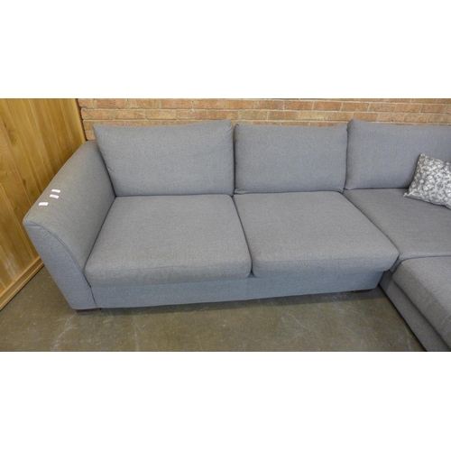 12 - A grey/mushroom upholstered RHF corner sofa (H=85cm x W=297cm x D (Return)=226cm)