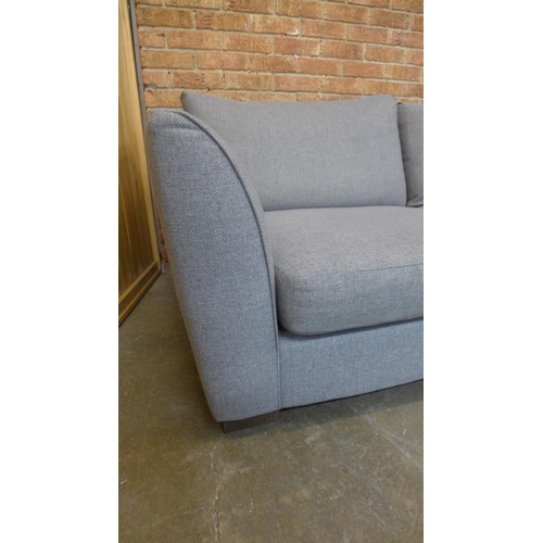 12 - A grey/mushroom upholstered RHF corner sofa (H=85cm x W=297cm x D (Return)=226cm)