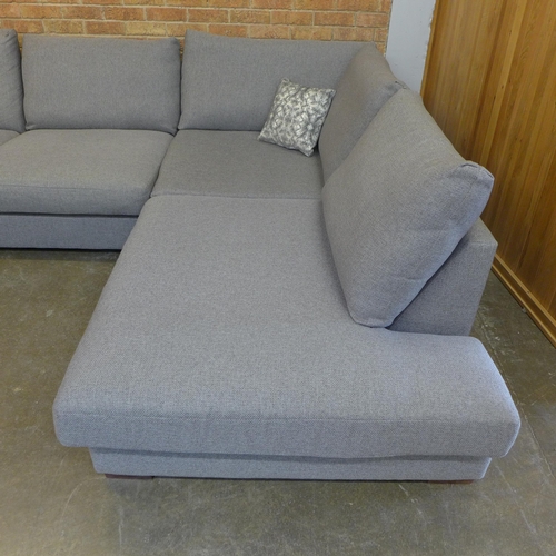 12 - A grey/mushroom upholstered RHF corner sofa (H=85cm x W=297cm x D (Return)=226cm)