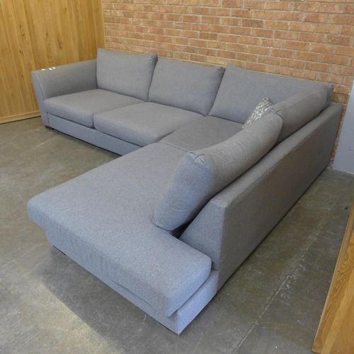 12 - A grey/mushroom upholstered RHF corner sofa (H=85cm x W=297cm x D (Return)=226cm)