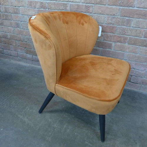 15 - A Lydel burnt orange upholstered shell back side chair (H=74cm x W=62cm x D=76cm)