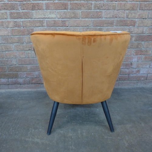 15 - A Lydel burnt orange upholstered shell back side chair (H=74cm x W=62cm x D=76cm)