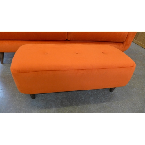 20 - A tangerine velvet buttoned back three seater sofa and footstool (H=90cm x W=187cm x D=90cm)