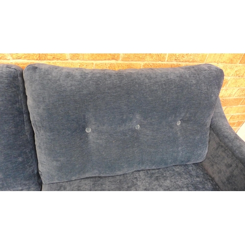 22 - A teal velvet buttoned back three seater sofa, small tear (H=90cm x W=190cm x D=90cm)