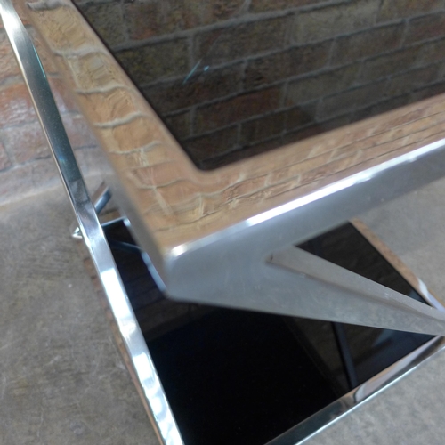 6 - A chrome and black glass lamp table (H=50cm x W=45cm x D=45cm)