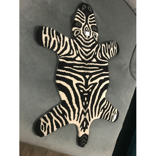 1368 - A child's bedroom rug in the form of a zebra