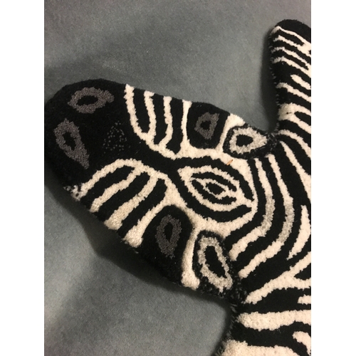 1368 - A child's bedroom rug in the form of a zebra