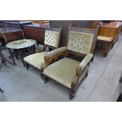 247 - A pair of Victorian Aesthetic Movement carved oak and green fabric upholstered lady's and gentleman'... 