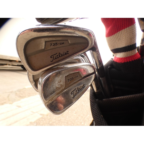 2236 - Titleist golf bag; 3 Titleist 910F woods and set of 735cm Mons