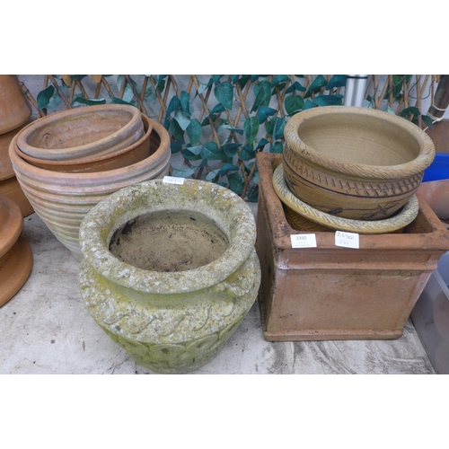 2390 - 7 Assorted plant pots: 1 stone, 4 terracotta and 2 glazed