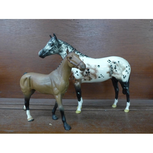 616 - A Royal Doulton appaloosa, leg repaired and a small Royal Doulton horse