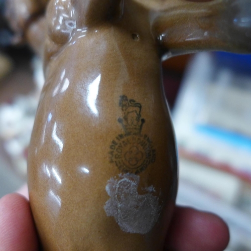 616 - A Royal Doulton appaloosa, leg repaired and a small Royal Doulton horse