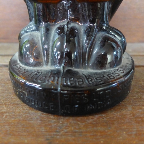 619 - A 1950s amber glass whisky decanter in the form of a Golden Eagle, 'Mohmeaks', Mohan Meakin Brewerie... 