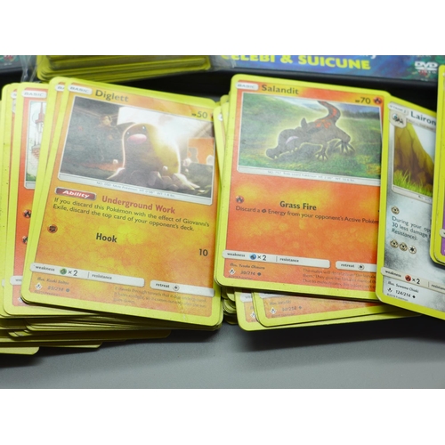 625 - Two hundred Pokemon cards with Pokemon DVDs