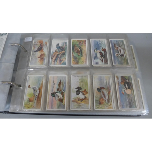 631 - Cigarette cards; an album of Players cigarette cards containing ten full sets including Derby and Gr... 