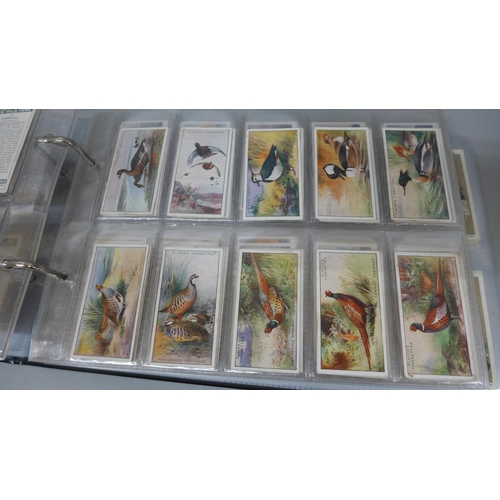 631 - Cigarette cards; an album of Players cigarette cards containing ten full sets including Derby and Gr... 