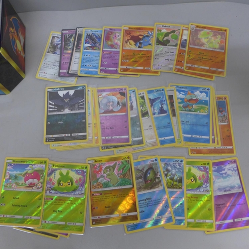 635 - 30 Reverse holo & 300 rare/uncommon and common Pokemon cards in tin