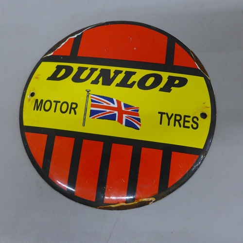 640 - A circular enamel Dunlop sign, 6