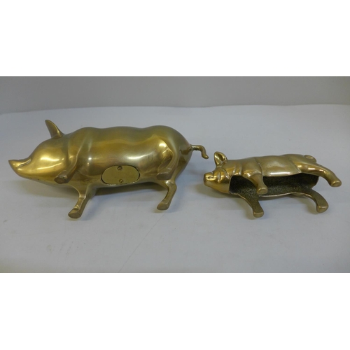 647 - Two brass pigs, one in the form of a money box