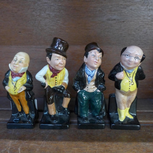 649 - Four Royal Doulton figures; Sam Weller, Pickwick, Mr Micawber and Artful Dodger