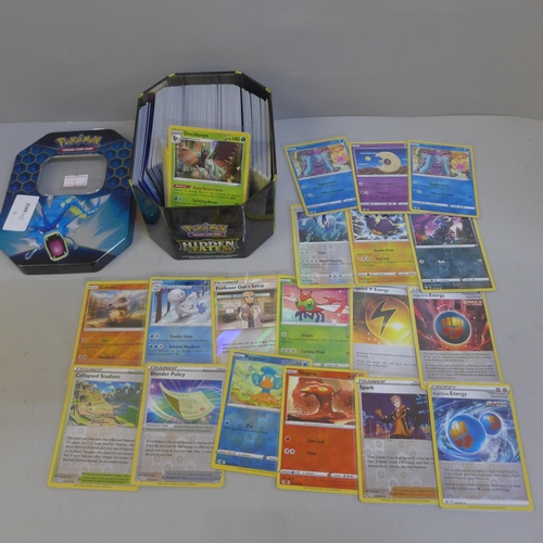 653 - 30 Reverse holo & 300 rare/uncommon and common Pokemon cards in tin