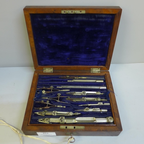 657 - A 19th Century walnut cased set of drawing instruments