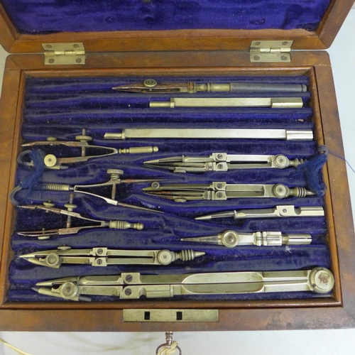 657 - A 19th Century walnut cased set of drawing instruments