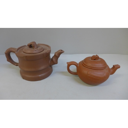 661 - Two Chinese terracotta teapots, each with character mark to base