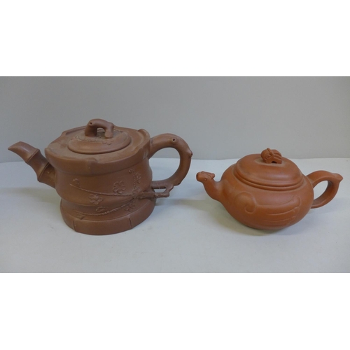 661 - Two Chinese terracotta teapots, each with character mark to base