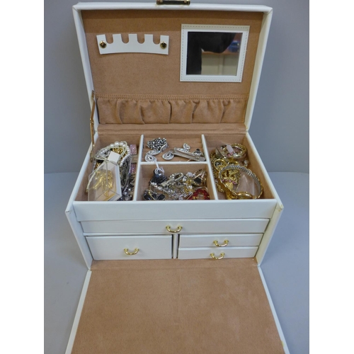 669 - A jewellery box with costume jewellery and wristwatches