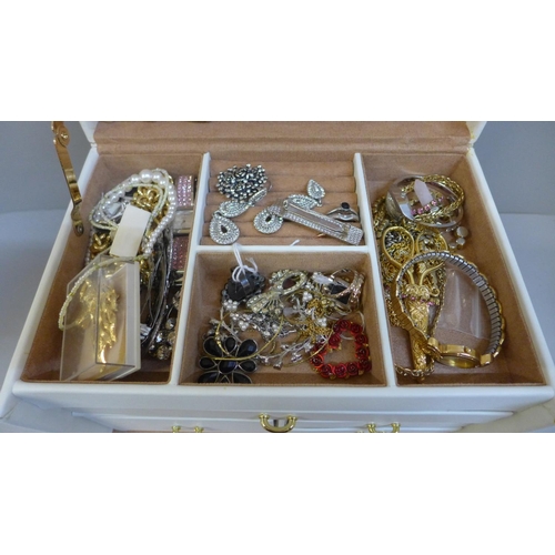 669 - A jewellery box with costume jewellery and wristwatches