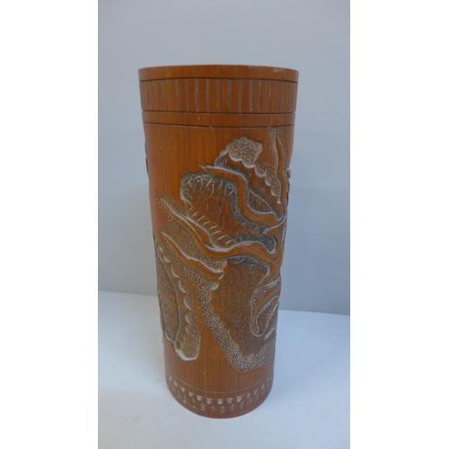 672 - An oriental bamboo brush pot, 26cm