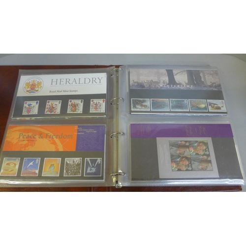 688 - Stamps; GB presentation packs in album, 43 no. packs with a face value of over £90