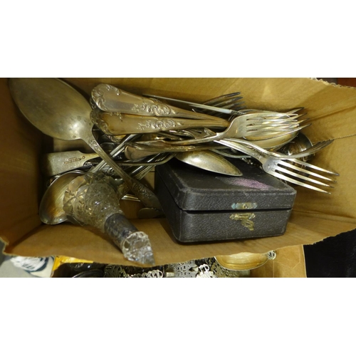 693 - A collection of flatware, a plated belt, grape scissors, (grape scissors broken) and assorted silver... 