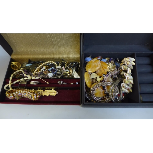 698 - Two jewellery boxes with contents, a collection of badges and a watch fob