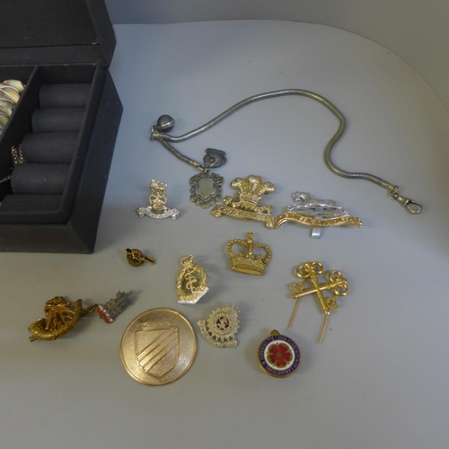 698 - Two jewellery boxes with contents, a collection of badges and a watch fob