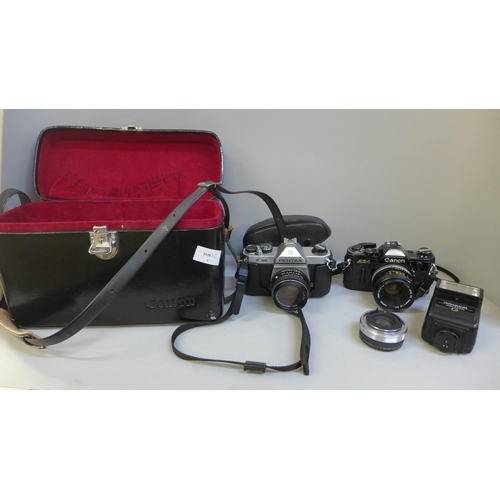 701 - A camera case with Canon AE-1 camera and Pentax K1000 35mm cameras, flash gun, film, etc.