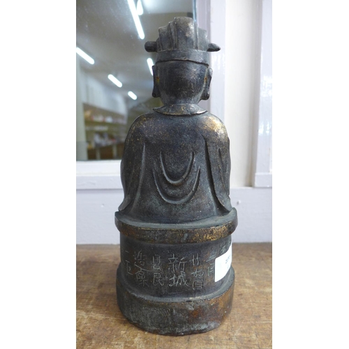 784 - A bronze figure of a Daoist deity, 25cm