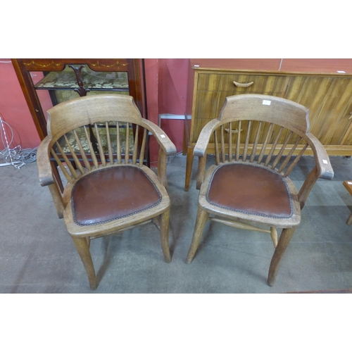 105 - A pair of Victorian oak Captain's desk chairs