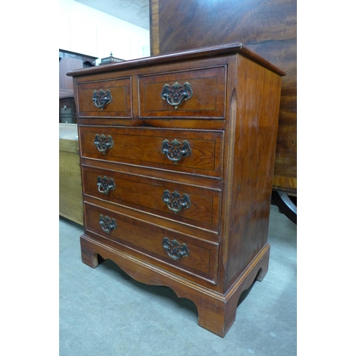 116 - A small yew wood chest of drawers